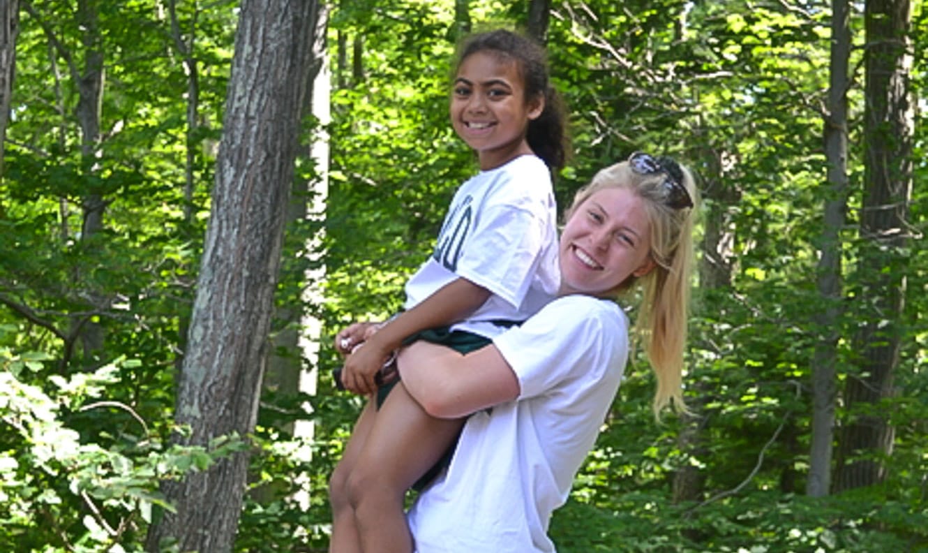 Staff holding a camper 